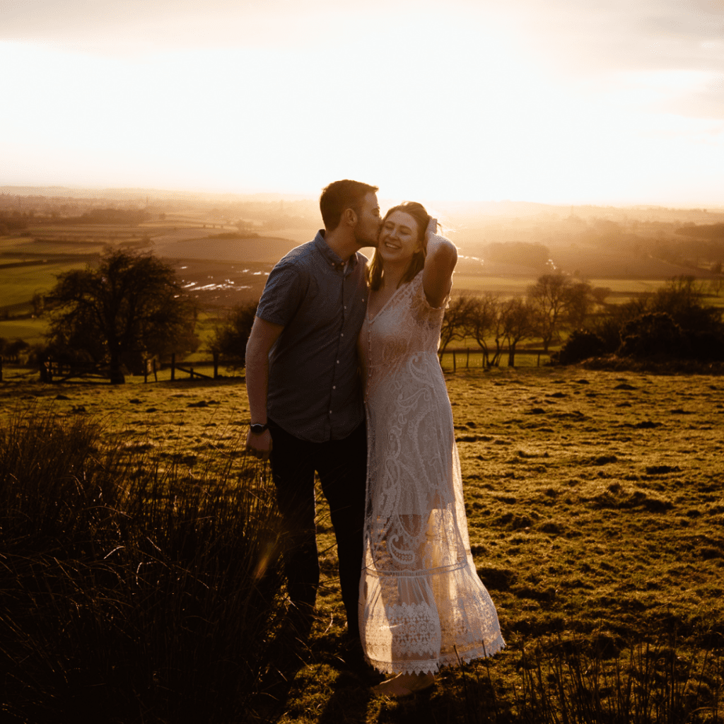 scotland elopement and wedding photographer and planner and photographer captures couple kissing at sunset