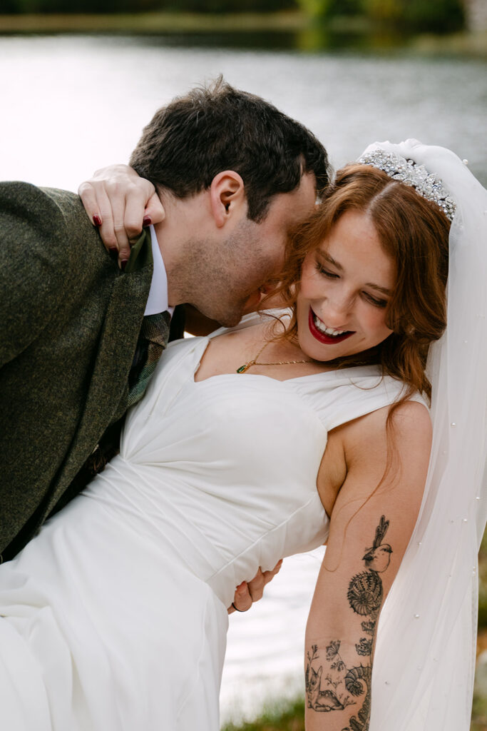 Couple laughing together during intimate wedding moment.