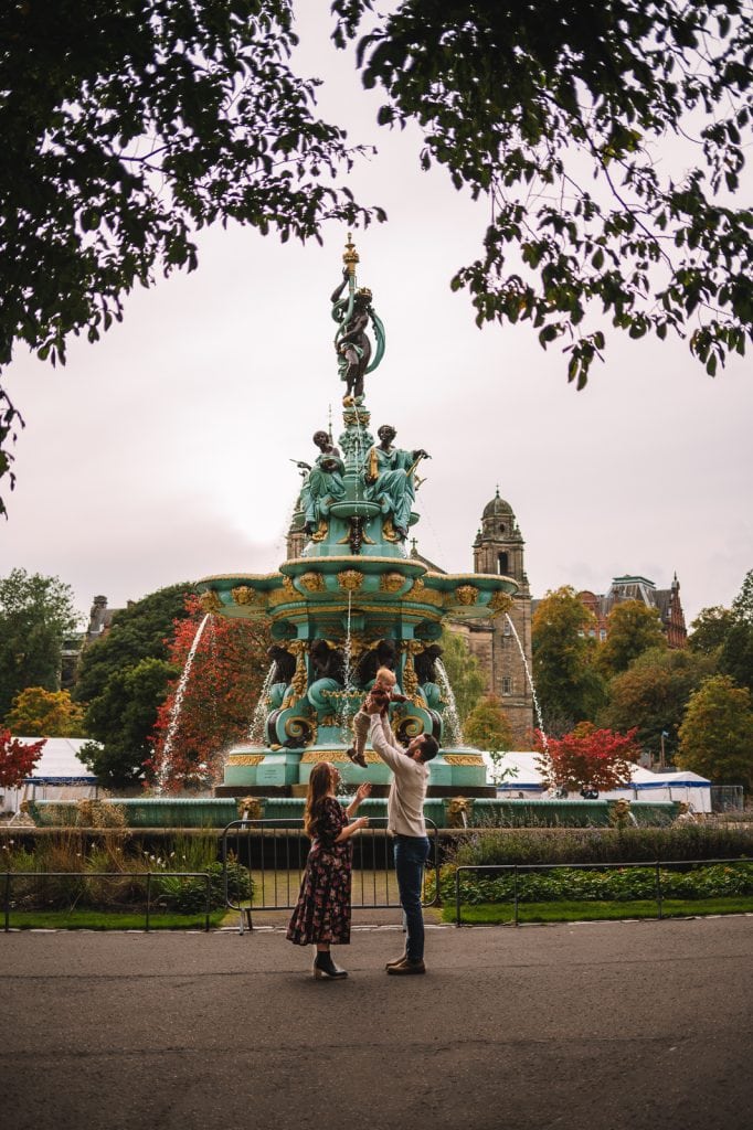 Family standing together near Ross Fountain in Princes Street Gardens