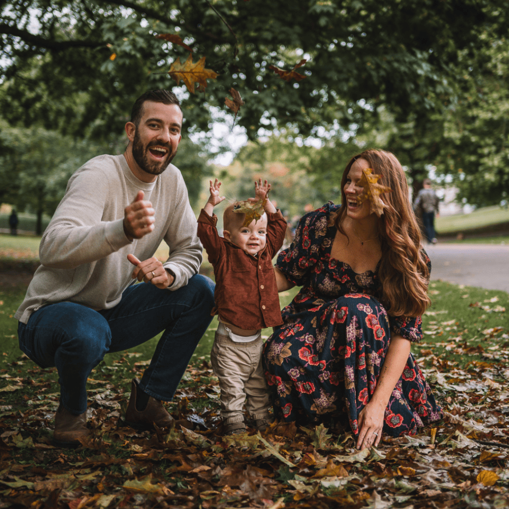 Family playing together in autumn park