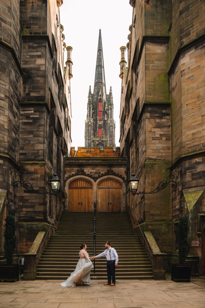 Couple standing on steps in front of St Giles’ Cathedral