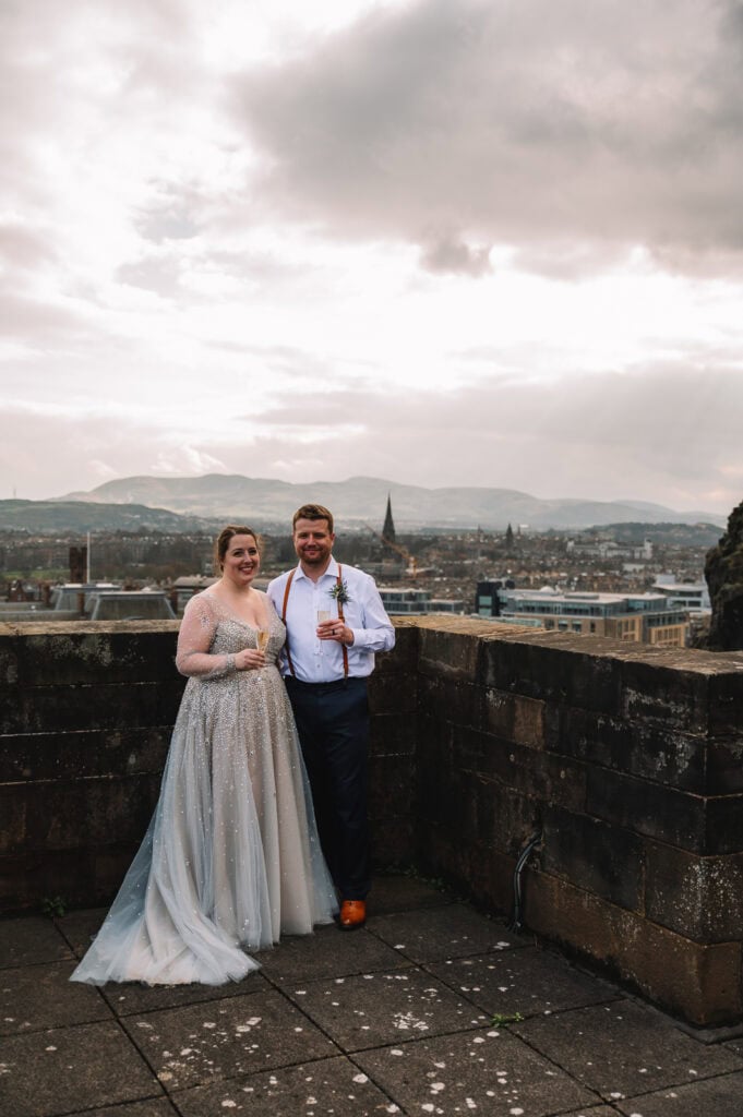 Couple celebrating on Edinburgh Castle walls