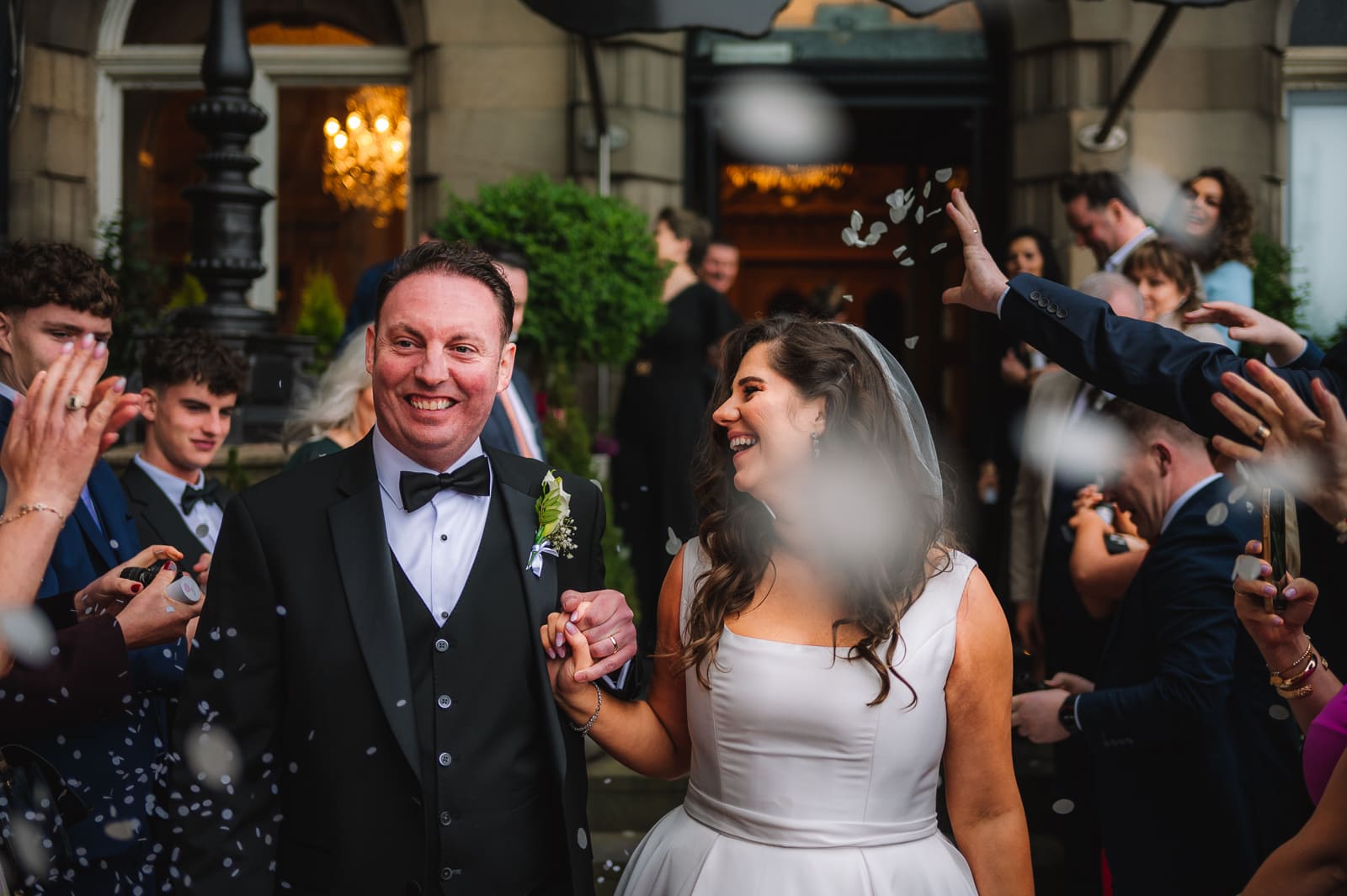 Bride and groom entering reception venue together