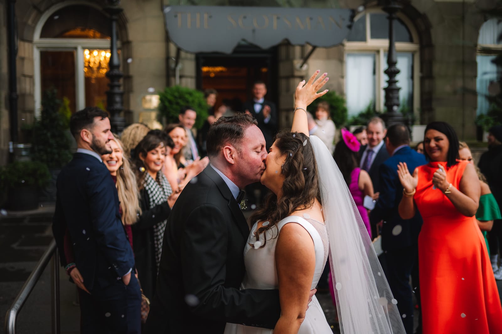 Couple kissing after ceremony
