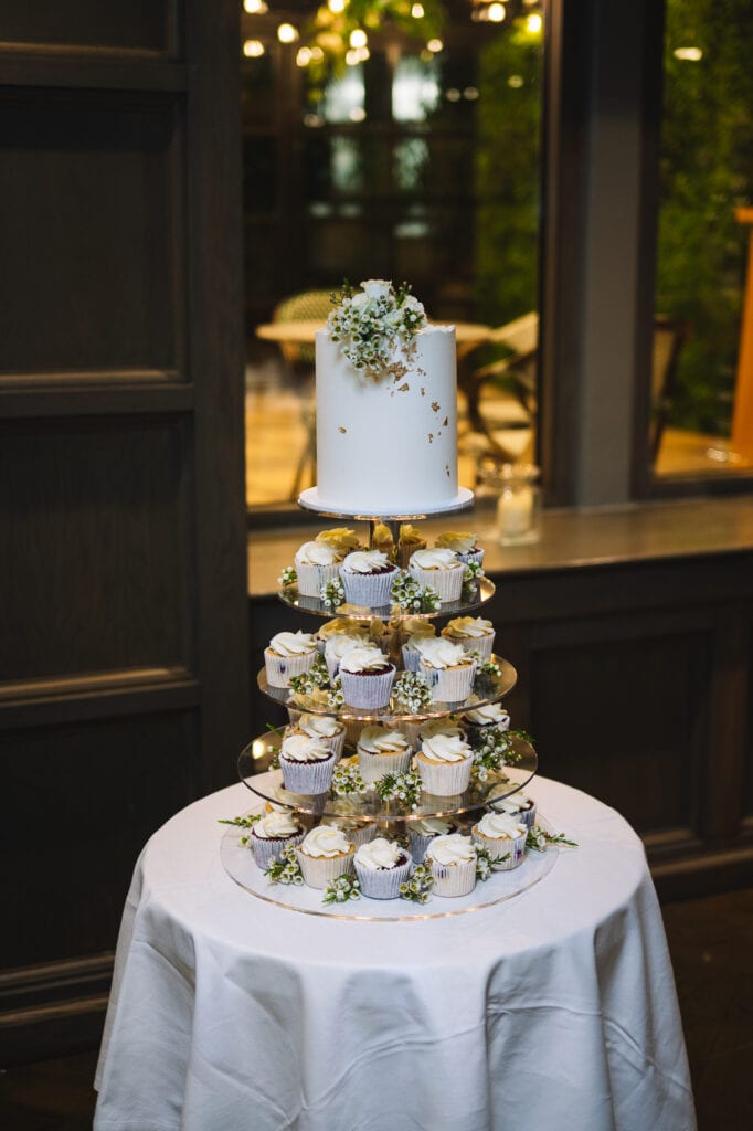 Wedding cake displayed on table at reception