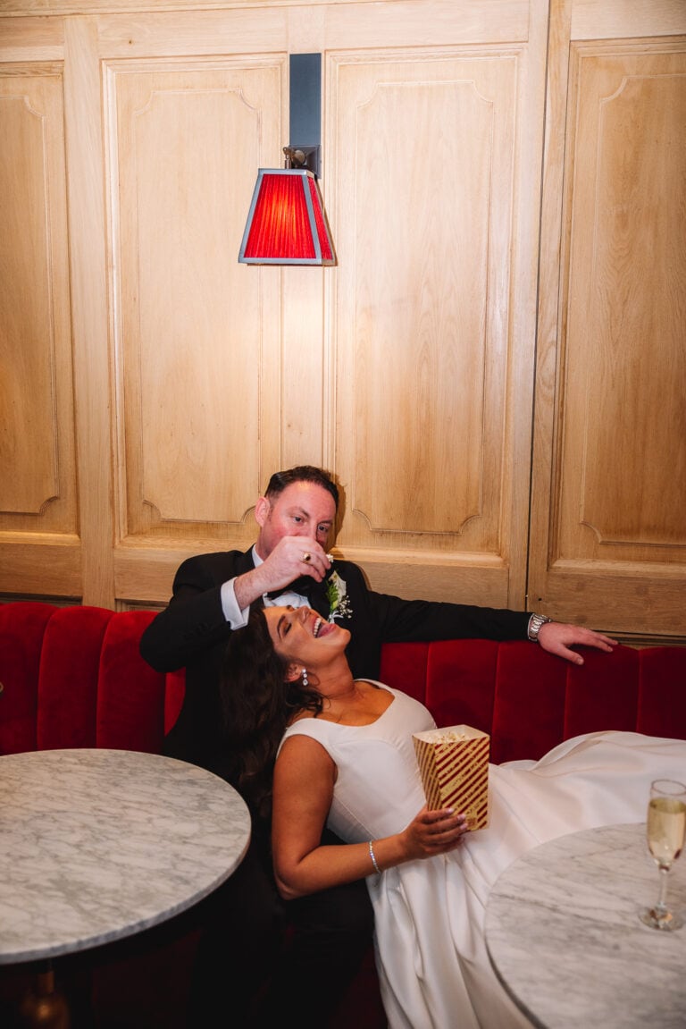 Bride and groom eating popcorn