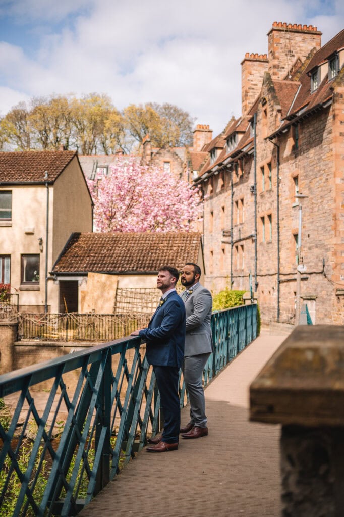 Couple standing on a bridge in a picturesque Edinburgh street