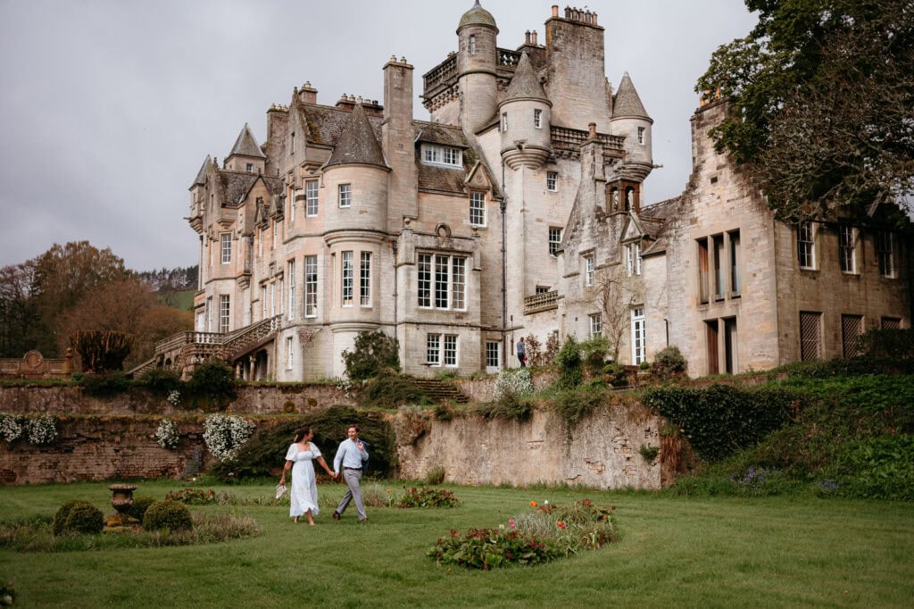  Exterior view of grand historic castle with gardens
