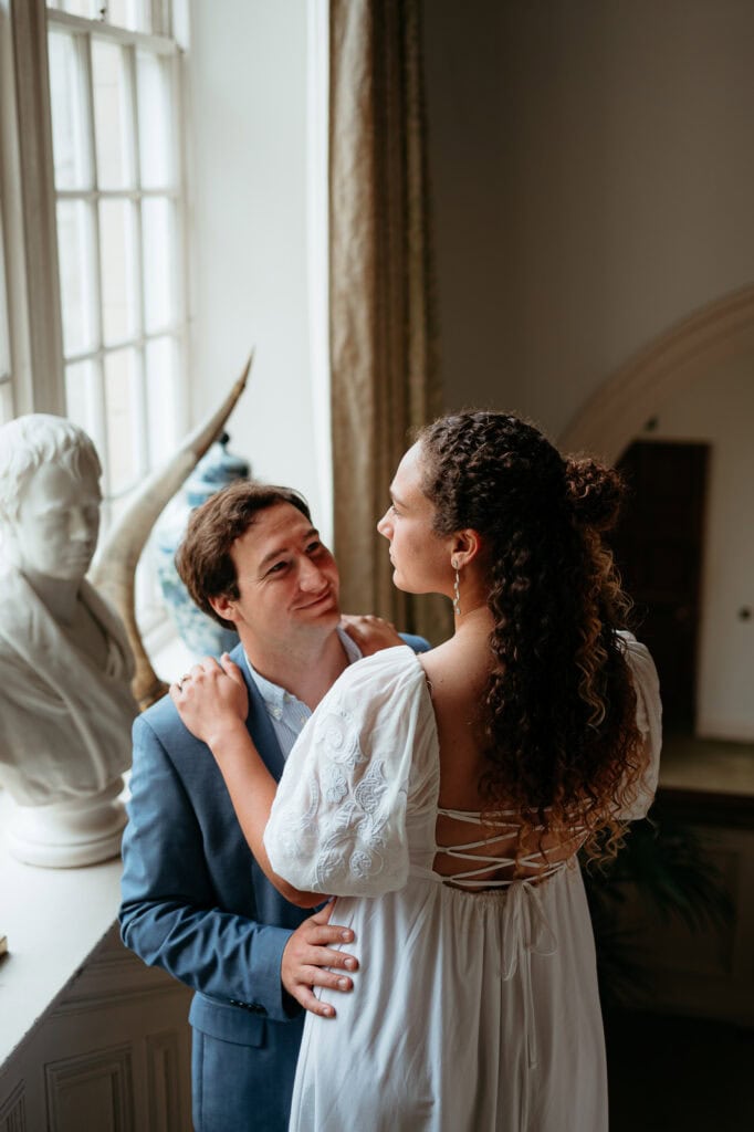  Couple sharing a quiet moment indoors in soft light
