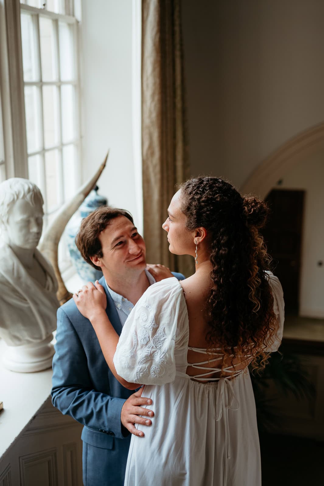 Couple sharing a quiet moment indoors in soft light