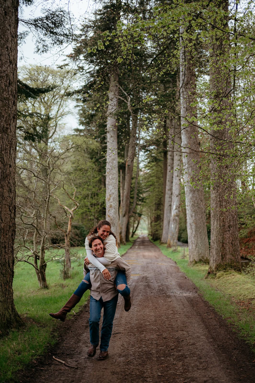  Couple embracing playfully on a woodland path
