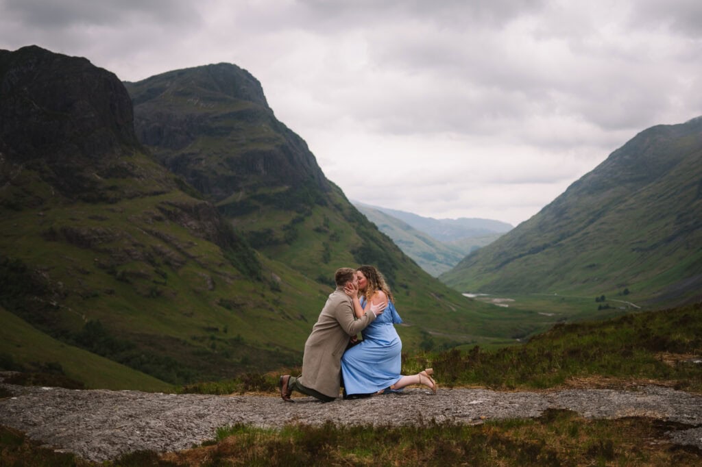  Couple embracing in mountainous Highland setting