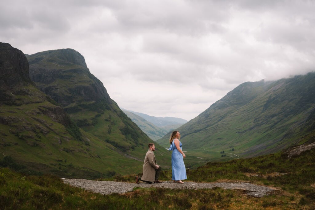  Proposal moment with partner kneeling in scenic Scottish glen