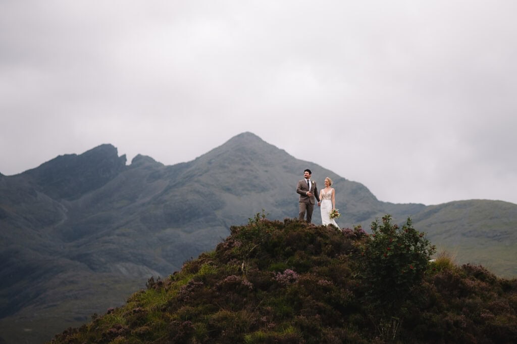 Couple walking through Highland valley