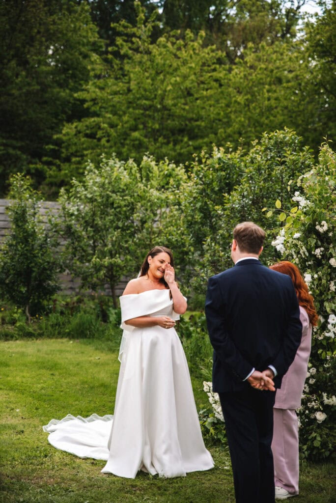 Bride standing during vows in an outdoor wedding ceremony