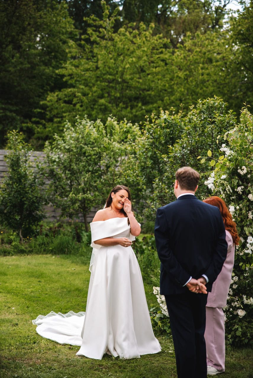 Bride standing during vows in an outdoor wedding ceremony