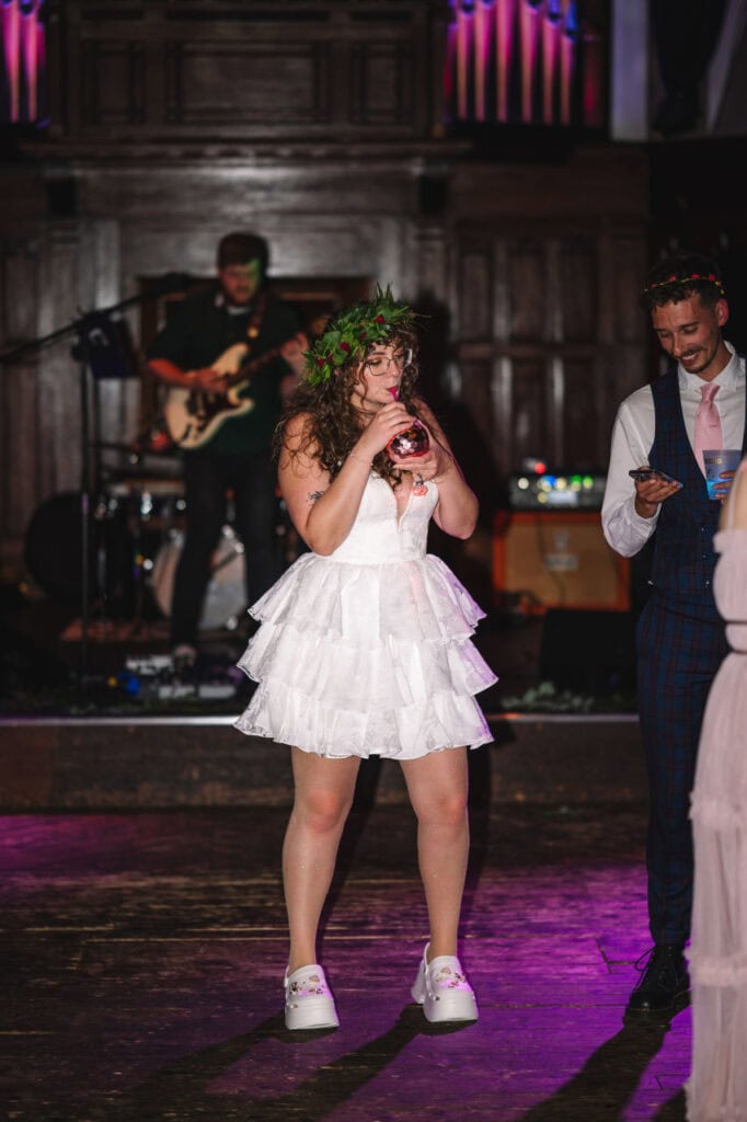 Bride dancing on stage during reception