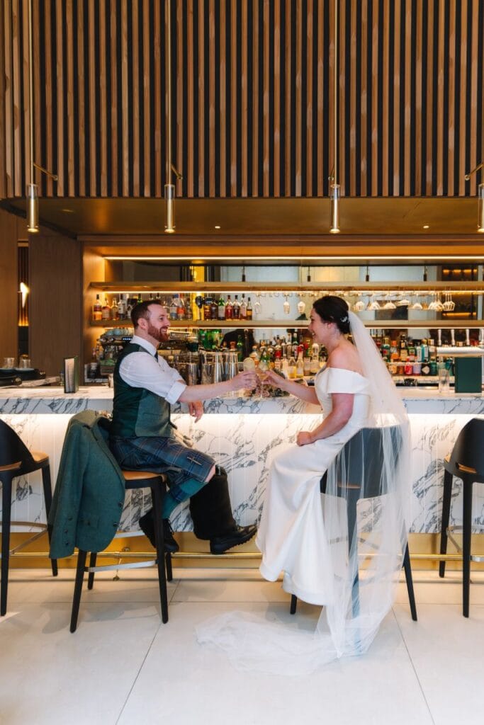 Couple sitting together at restaurant table after ceremony