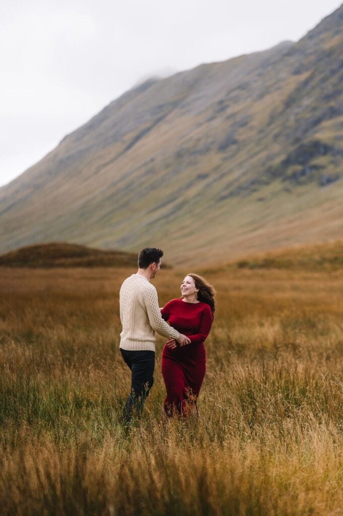 Couple embracing in Scottish Highlands landscape