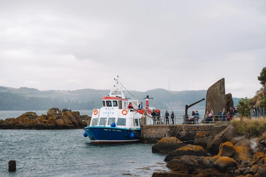 Small boat arriving at harbour in Scotland