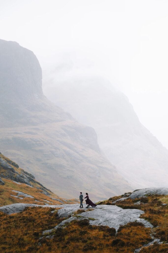 Couple eloping in misty Glencoe landscape