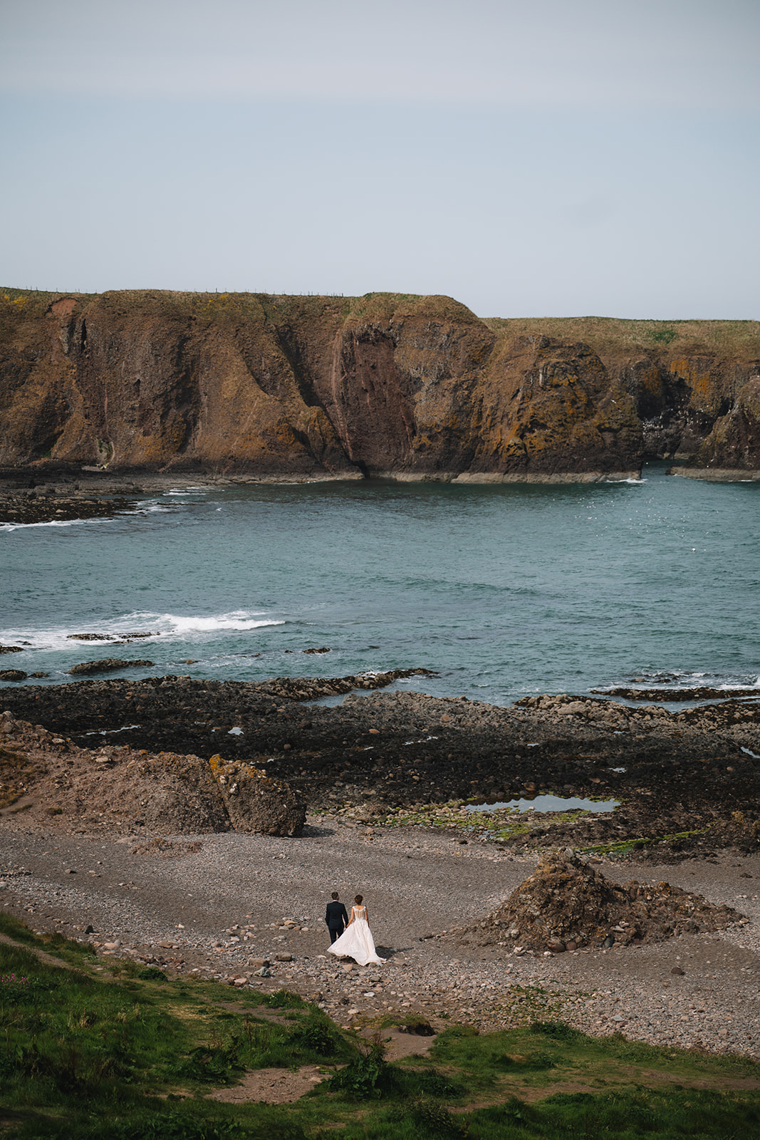 Coastal cliffs and ocean view in rugged Scottish landscape.