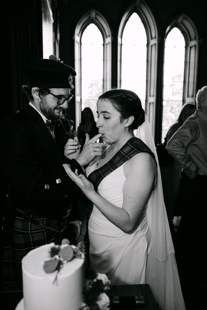 Couple sharing emotional moment during ceremony indoors.