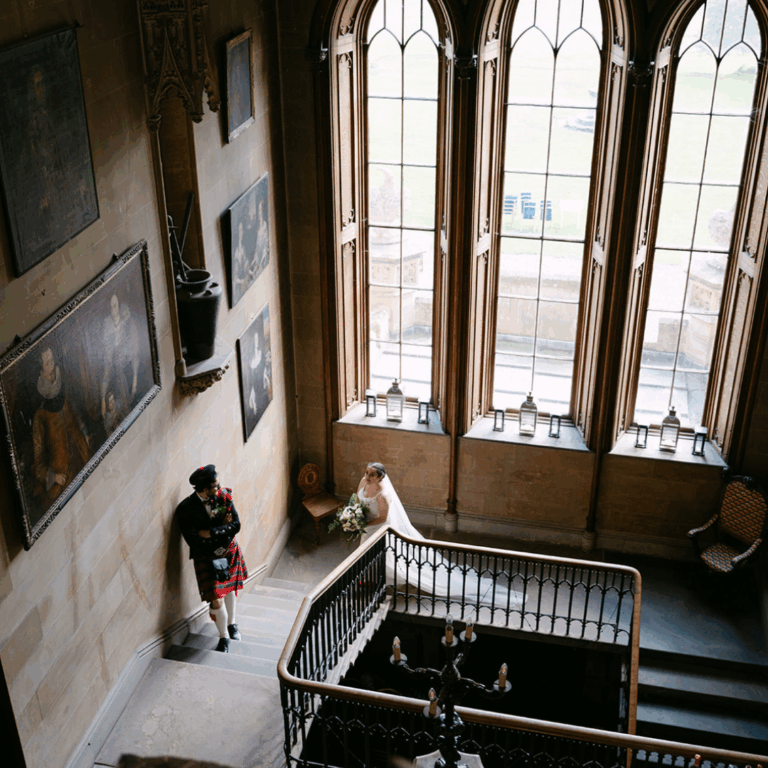 Interior staircase view with large windows and natural light.