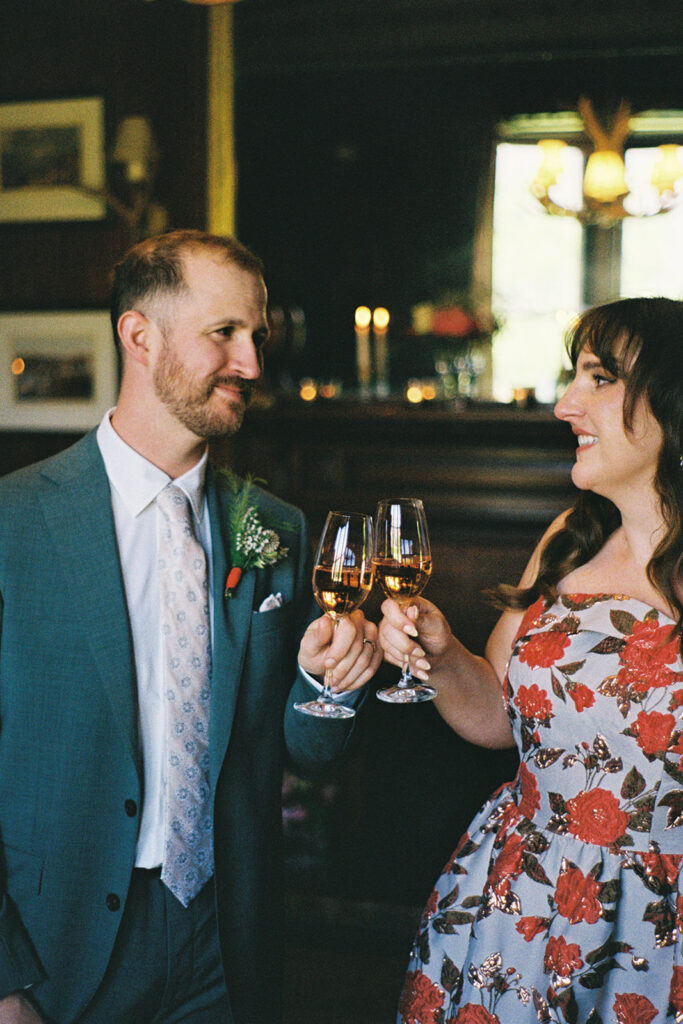 wedding couple cheers with champagne after their wedding