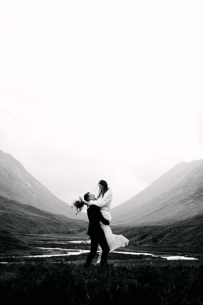 groom spins bride around in glencoe