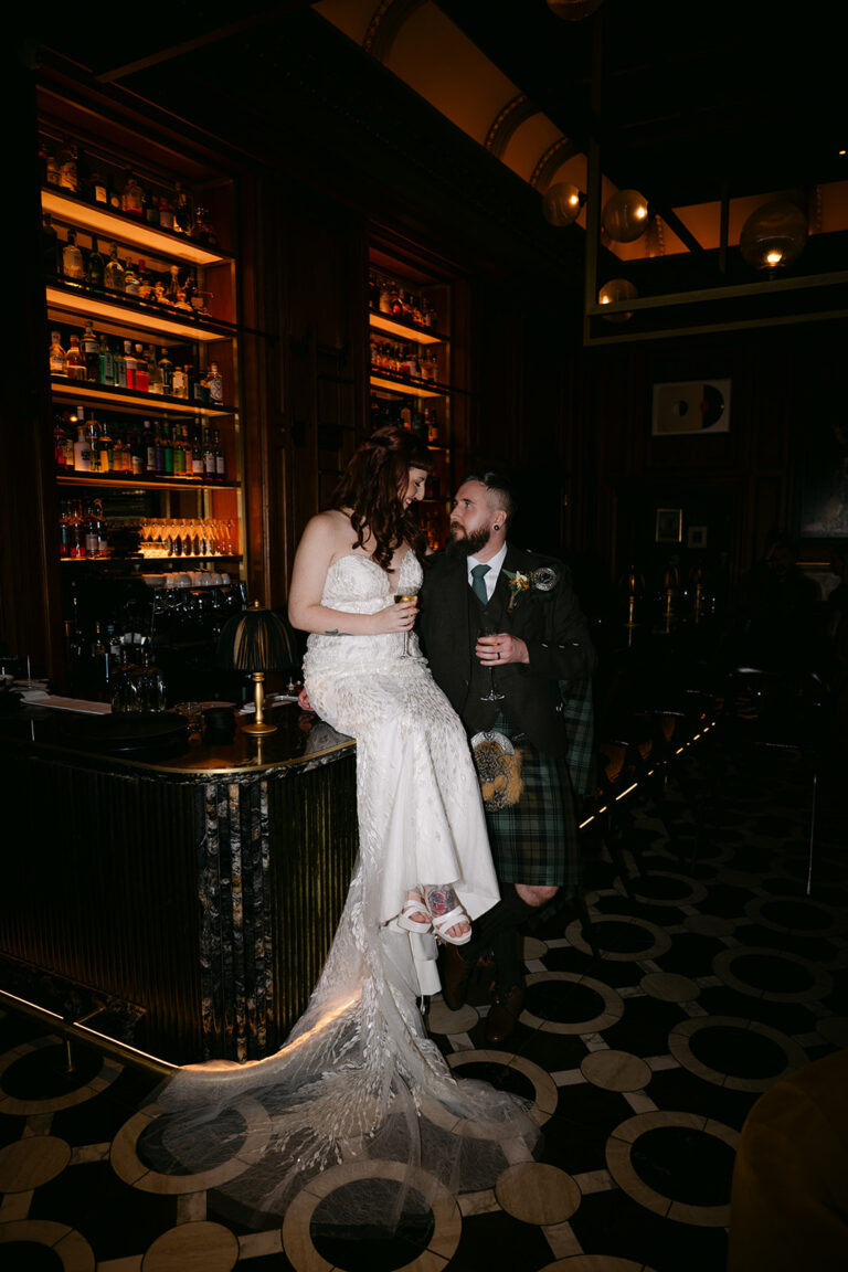 wedding couple in virgin hotels edinburgh sits in commons club bar