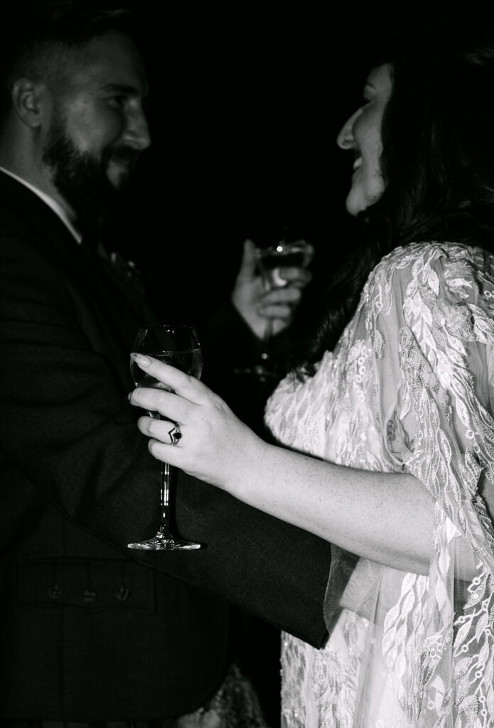 wedding couple in virgin hotels edinburgh drinks champagne