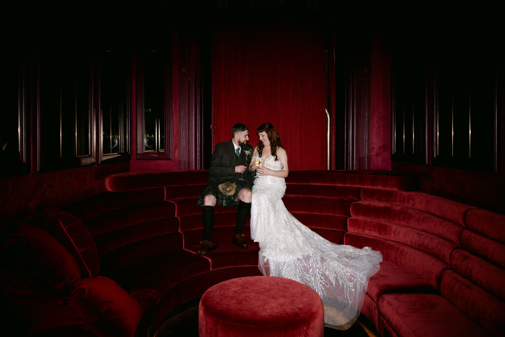 wedding couple in virgin hotels edinburgh sits in scarlet lounge