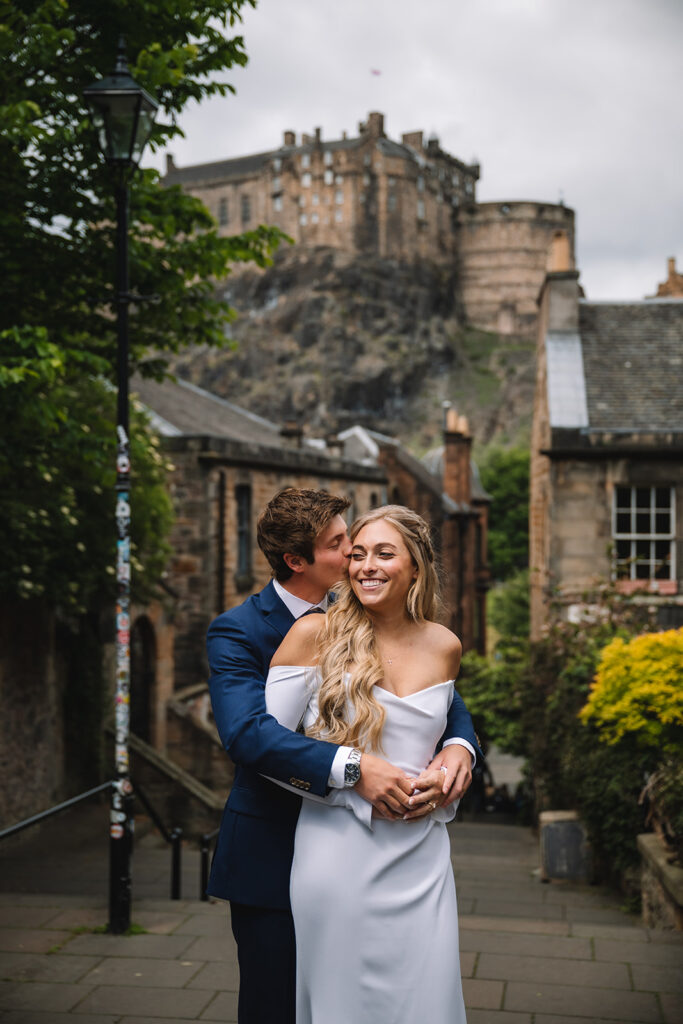 couple takes wedding photos in edinburgh