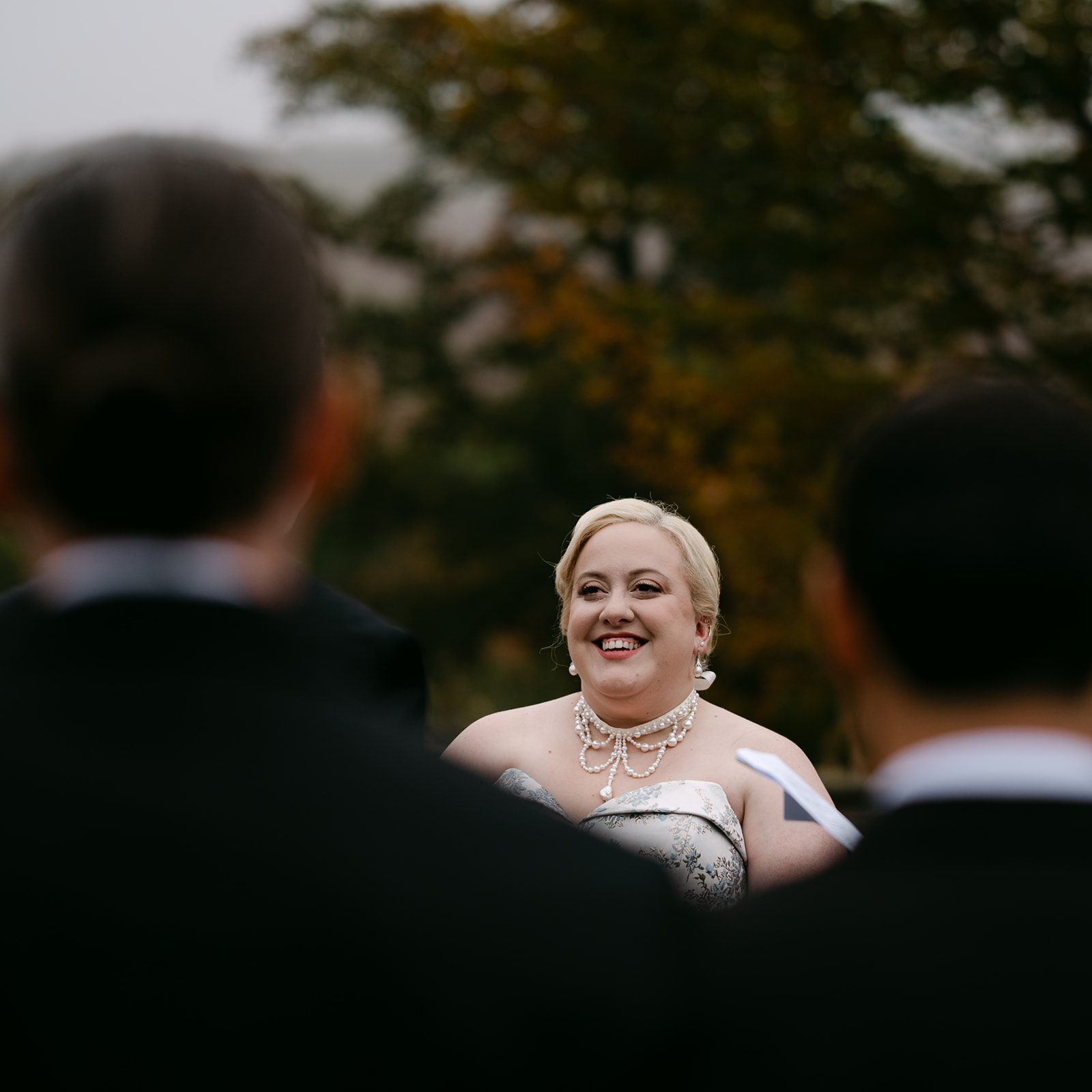 bride smiles during wedding ceremony