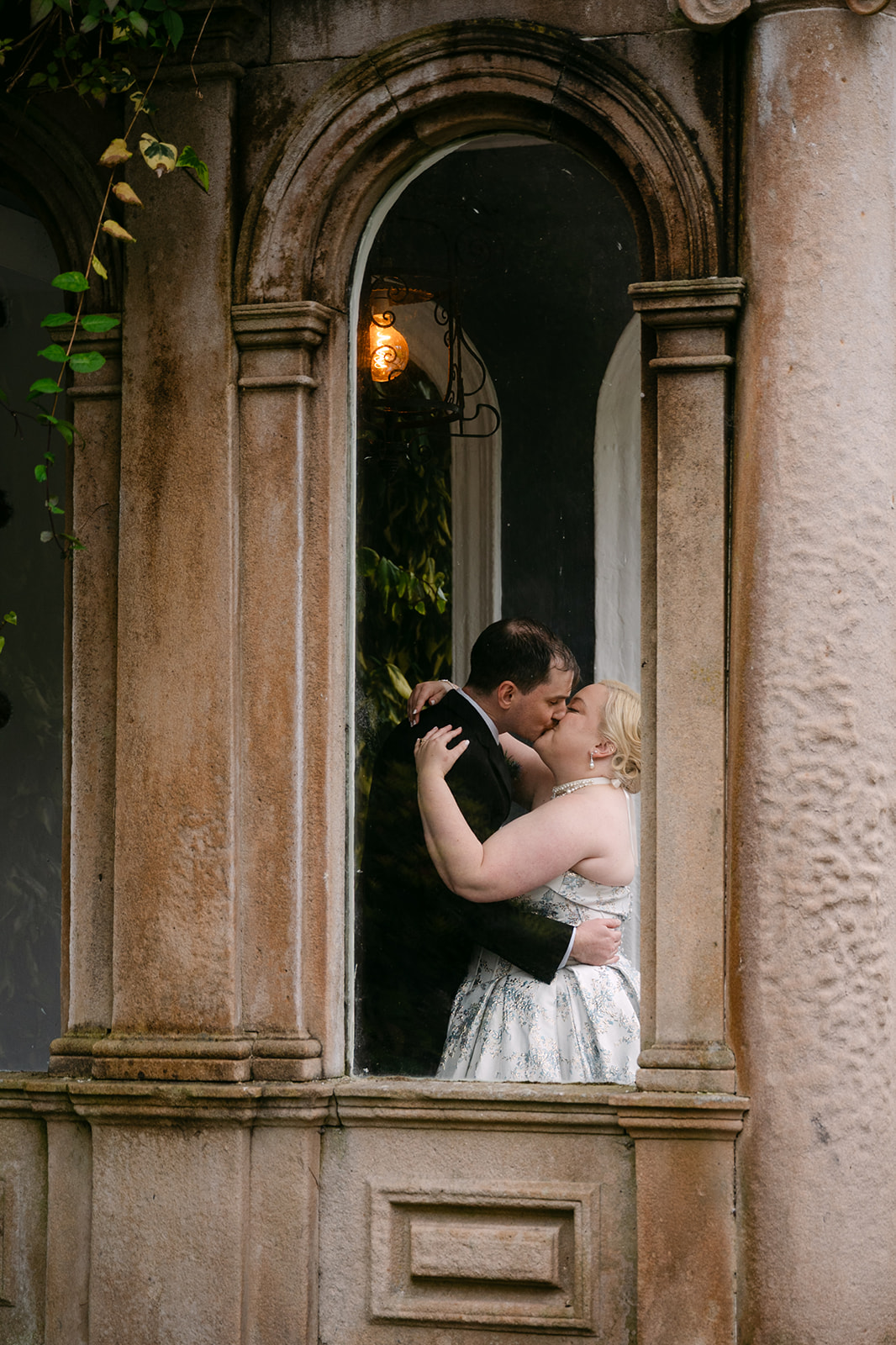 bride and groom share a kiss