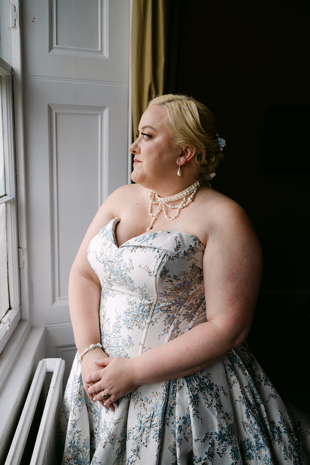 bride faces window pre-ceremony