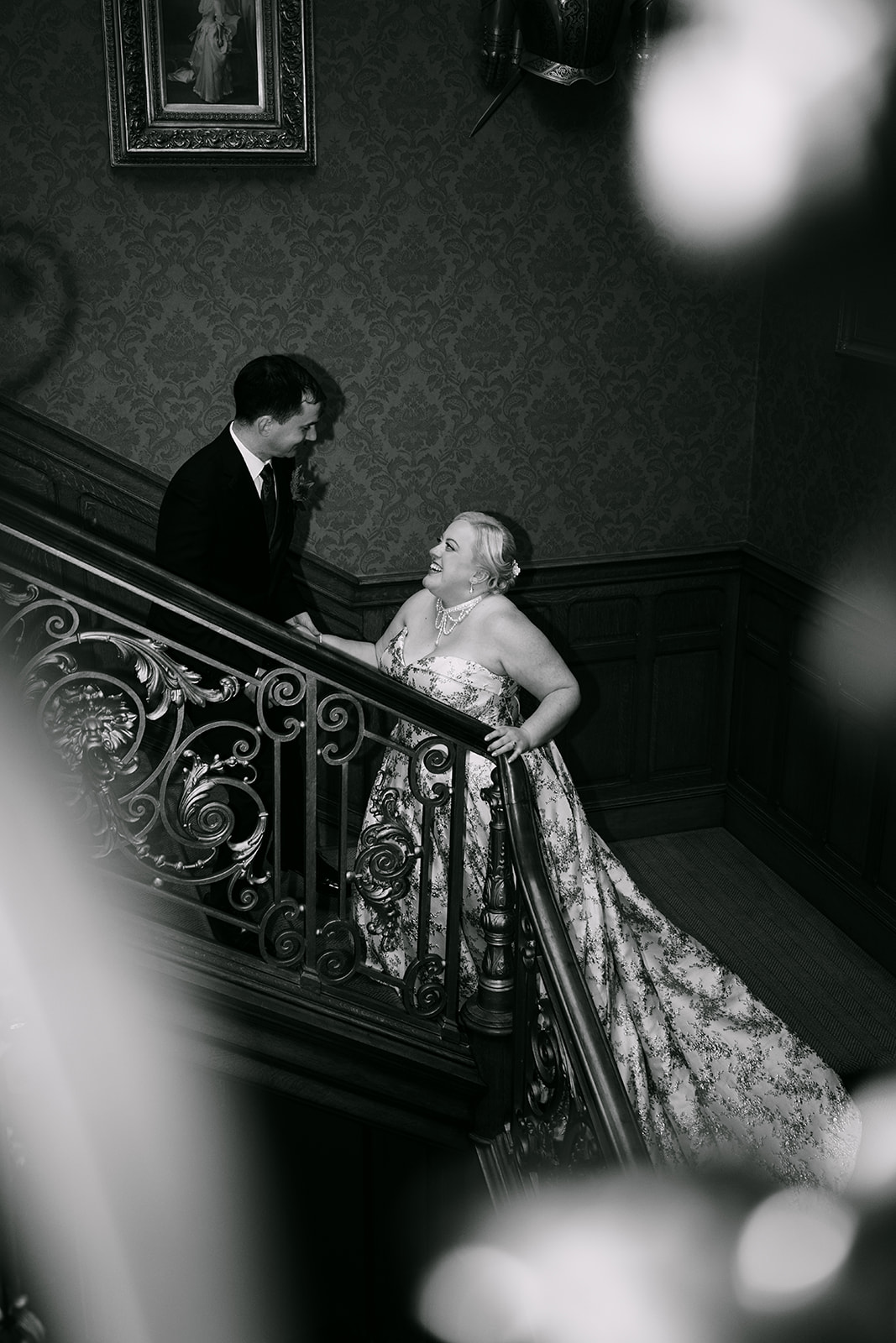 wedding couple ascends auchen castle stairs