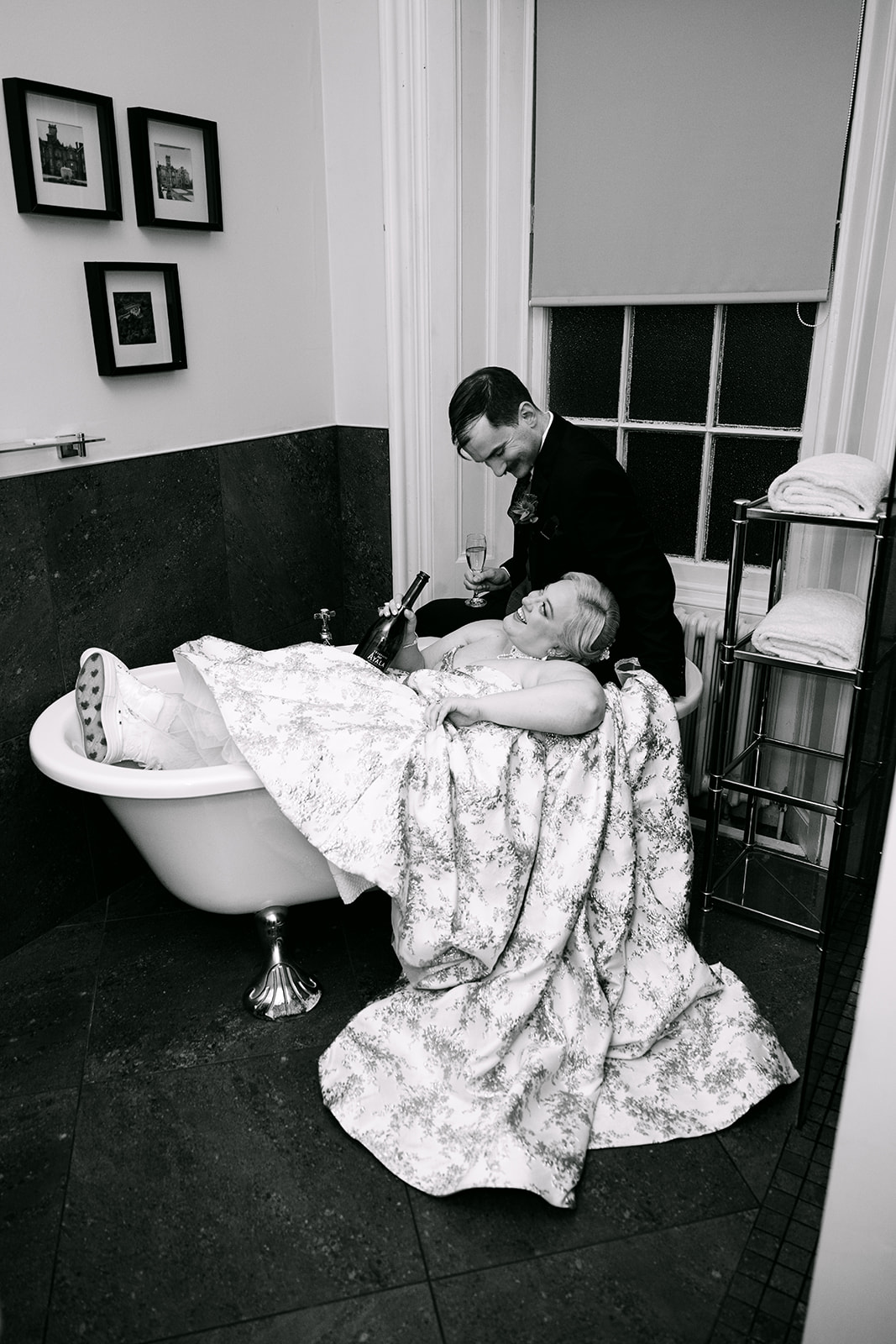wedding couple sits in bathtub