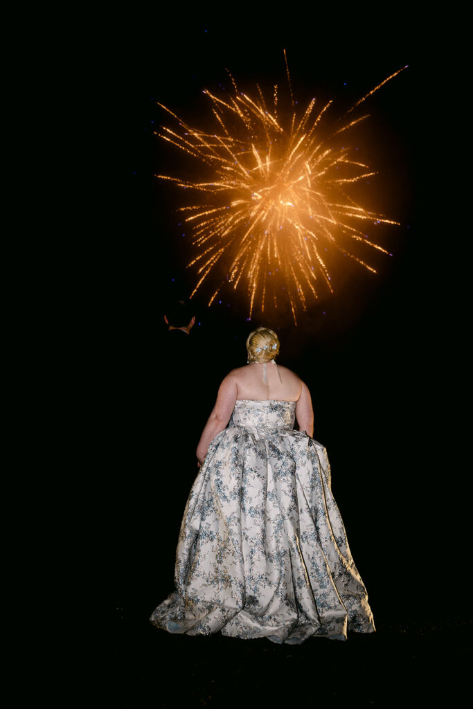 recently married couple watches fireworks at auchen castle wedding