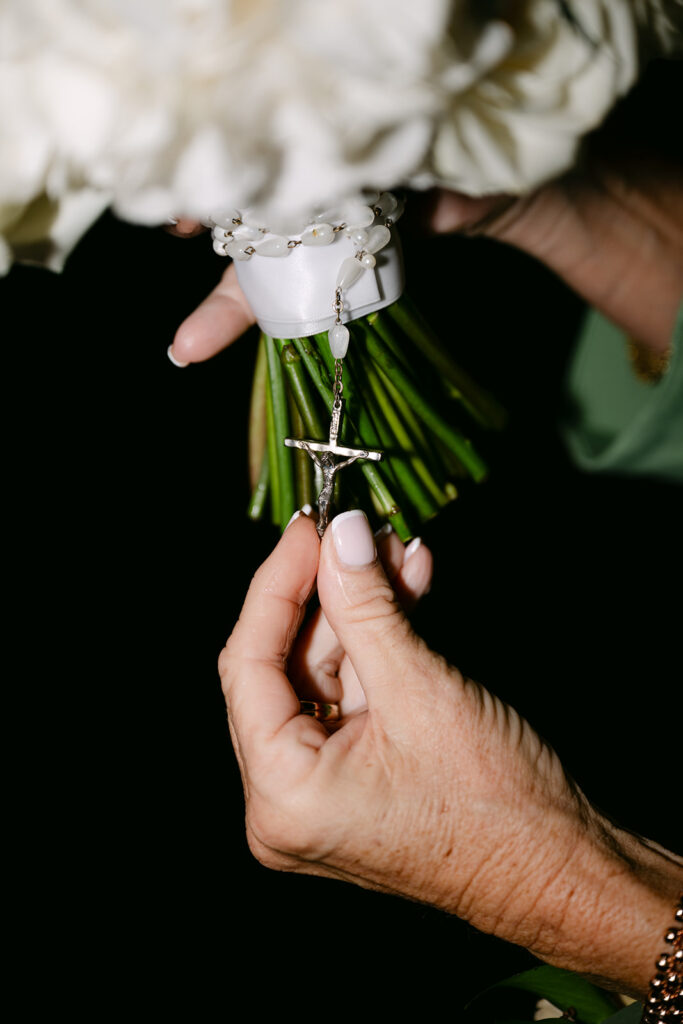 cross on bouquet close up details