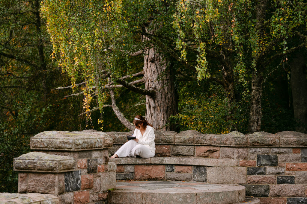 bride writes vows outside tower ess