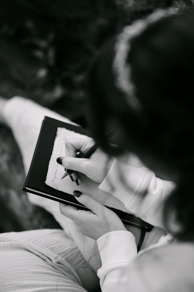 close up shot of bride writing vows