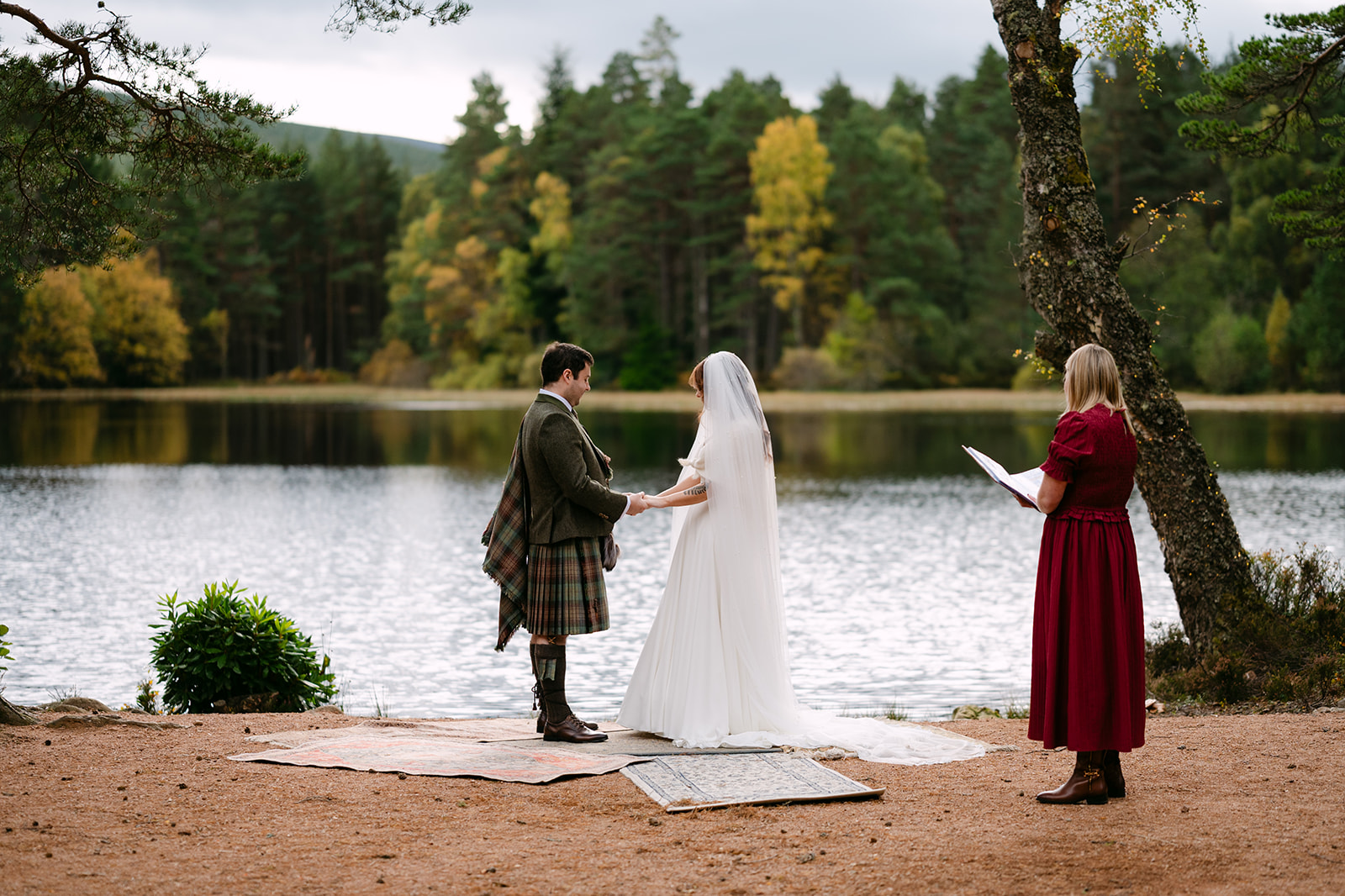 wedding couple saying their vows in glen tanar alongside celebrant