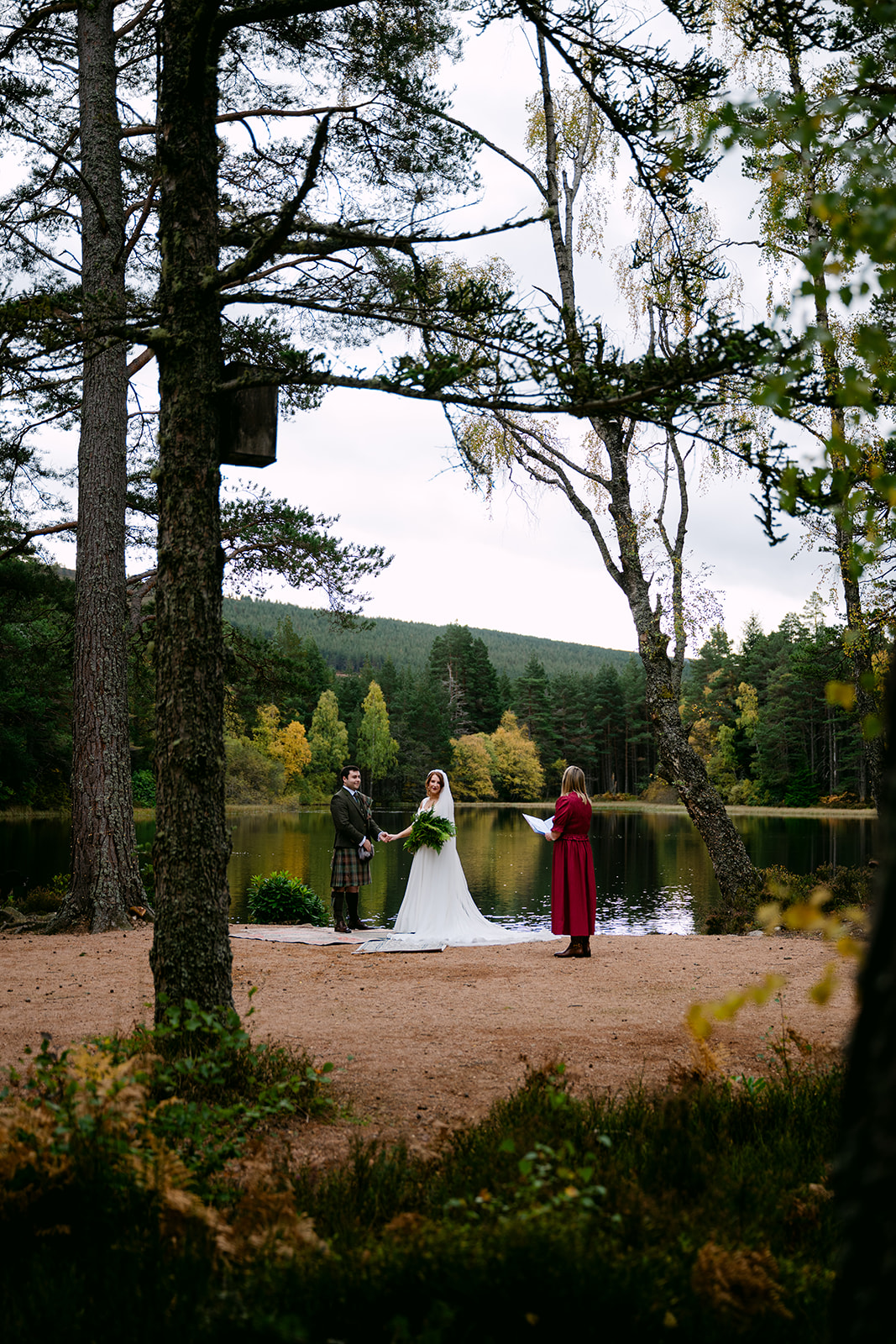 wedding couple saying their vows in glen tanar alongside celebrant