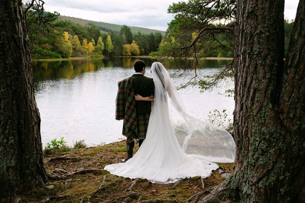 wedding couple in glen tanar overlooking the lake