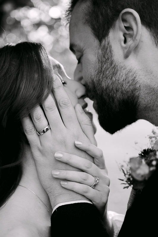 close up of bride and groom's rings