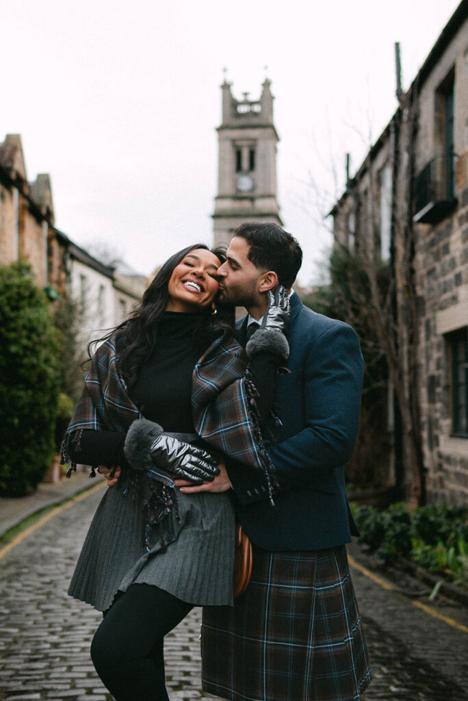 couple cuddles on circus lane in edinburgh photoshoot