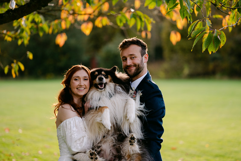 couple holds dog