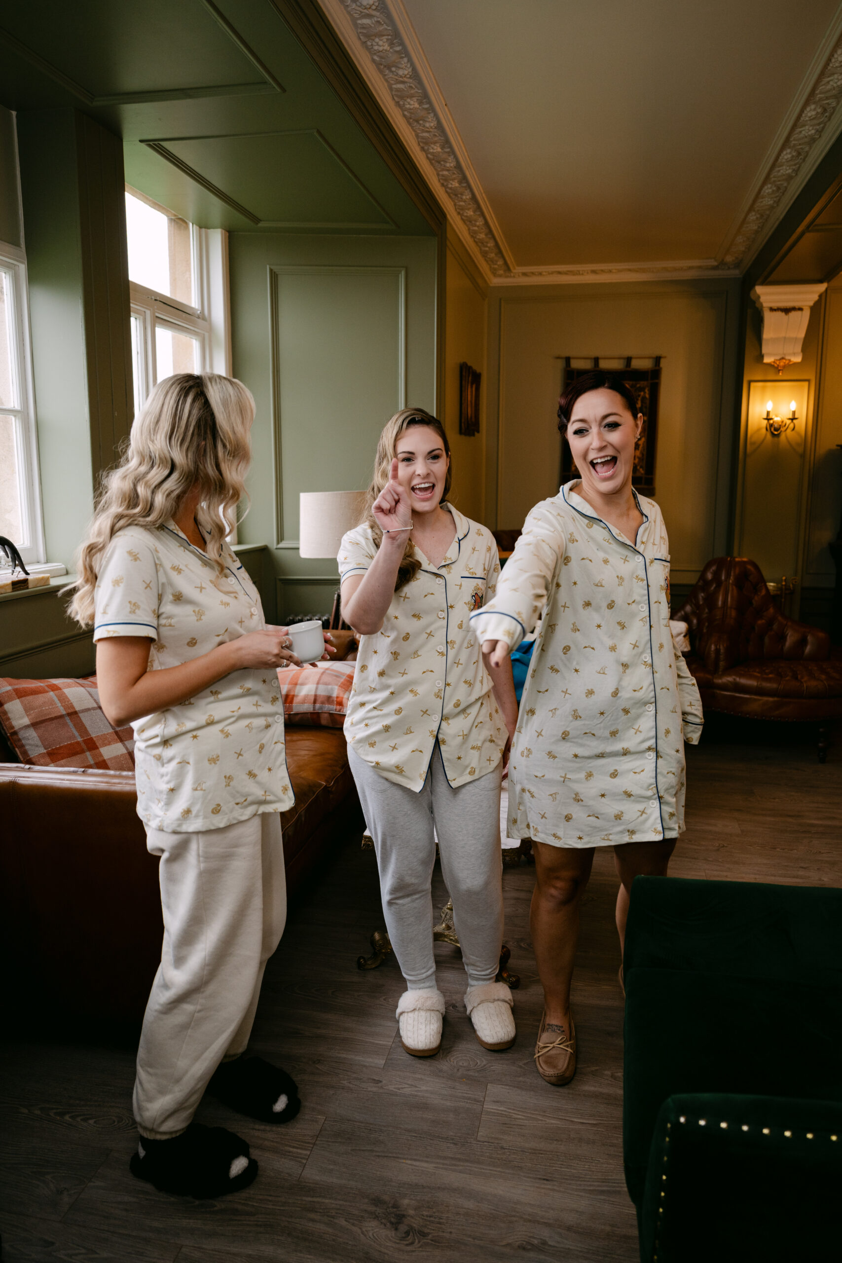 bridal party getting ready candid shot at auchen castle